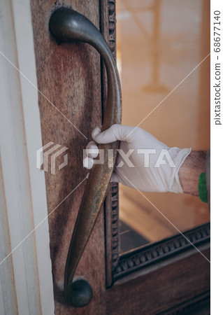 Man hand in plastic glove virus protection 68677140