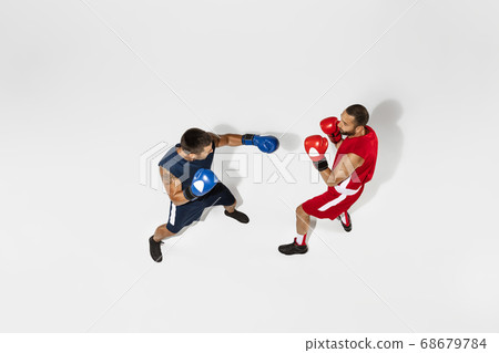 Two professional boxers boxing isolated on white studio background, action, top view 68679784