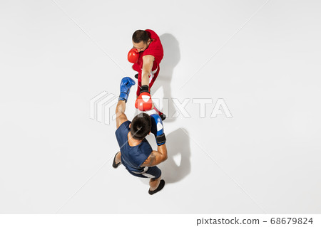 Two professional boxers boxing isolated on white studio background, action, top view 68679824