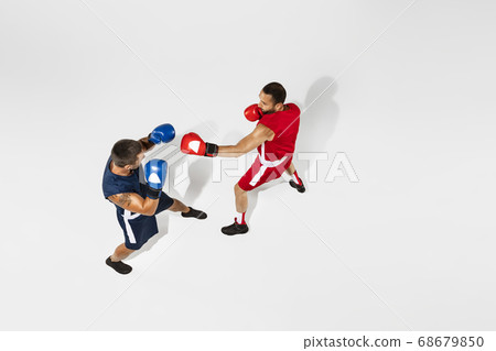 Two professional boxers boxing isolated on white studio background, action, top view 68679850