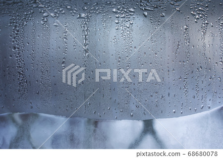 Frozen drops of water on winter icy white window pane. Pattern of vertical rows of frosty water drops on the window glass. Copy space for the text. 68680078