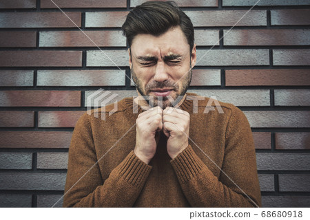 Religion concept. Caucasian young man praying 68680918