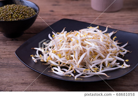 Fresh beansprouts on black plate background 68681058