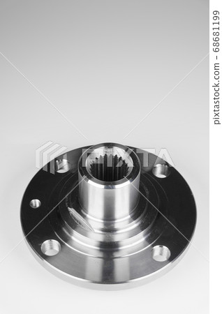 One of the parts of the hub set of spare parts of the front suspension on a gray background One of the parts of the hub set of spare parts of the front suspension on a gray background 68681199