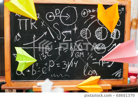 school concept, colored paper planes fly near the school board, university 68681370