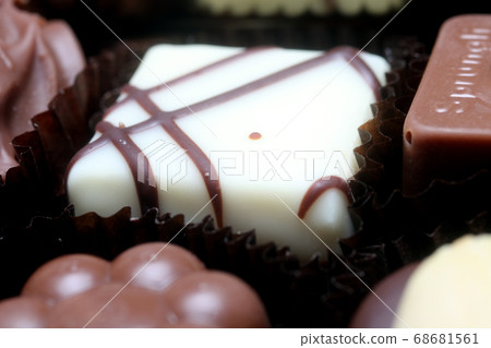 Box with chocolate candies 68681561