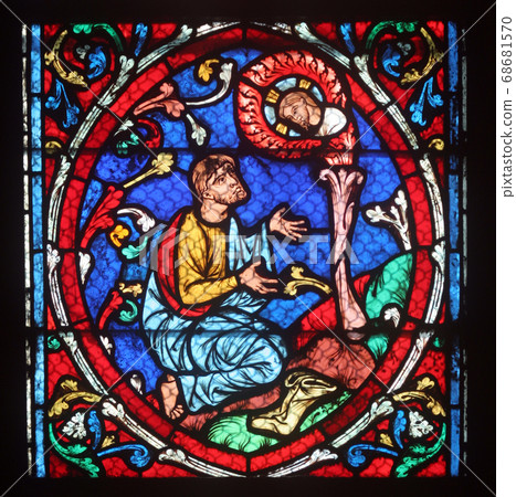 Colorful stained glass window in Notre Dame Cathedral in Paris Colorful stained glass window in Notre Dame Cathedral in Paris 68681570
