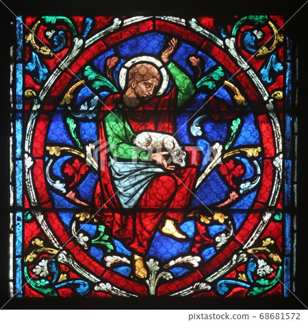 Colorful stained glass window in Notre Dame Cathedral in Paris Colorful stained glass window in Notre Dame Cathedral in Paris 68681572