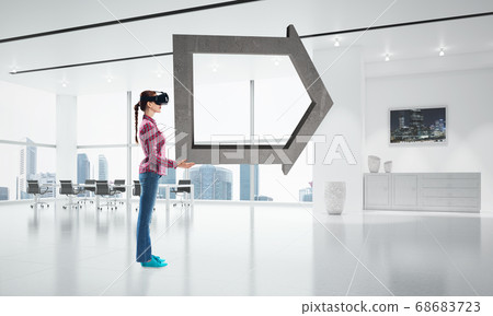 Girl in virtual reality mask experiencing virtual technology world. Mixed media Girl in virtual reality mask experiencing virtual technology world. Mixed media 68683723