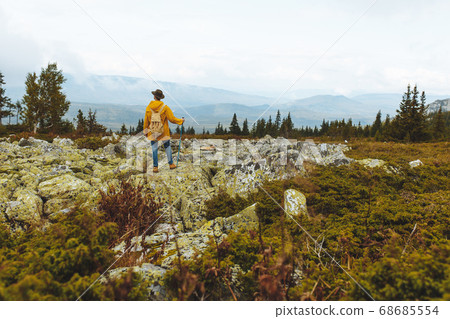 romatic young adventurous man enjoying the beauty of landscape 68685554