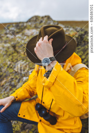 young backpacker sitting on the rock having a rest 68686501