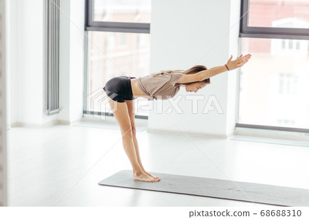 woman staightening her arms and doing incline 68688310