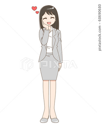 幸福的女人,穿著一套西裝,將一隻手放在她的臉頰上 幸福的女人,穿著一套西裝,將一隻手放在她的臉頰上 68690680