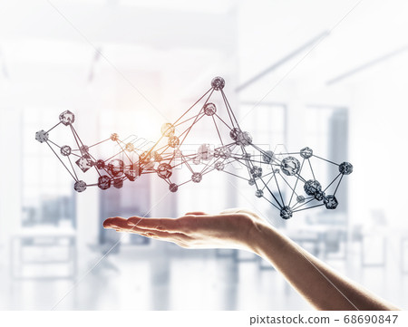 Wireless connection presented by lines and dots in human hand 68690847