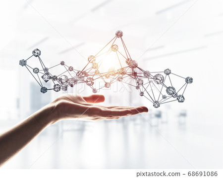 Wireless connection presented by lines and dots in human hand Wireless connection presented by lines and dots in human hand 68691086