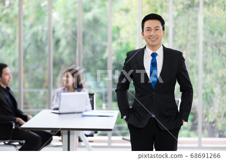 handsome adult asian businessman in office 68691266