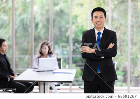 handsome adult asian businessman in office 68691267