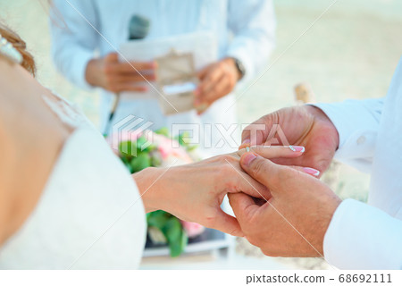 Hands of the newlyweds at the wedding ceremony of Hands of the newlyweds at the wedding ceremony of 68692111
