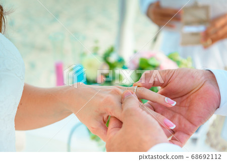 Hands of the newlyweds at the wedding ceremony of Hands of the newlyweds at the wedding ceremony of 68692112