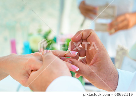 Hands of the newlyweds at the wedding ceremony of Hands of the newlyweds at the wedding ceremony of 68692119