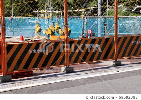 Safety first fence at construction site Safety first fence at construction site 68692388