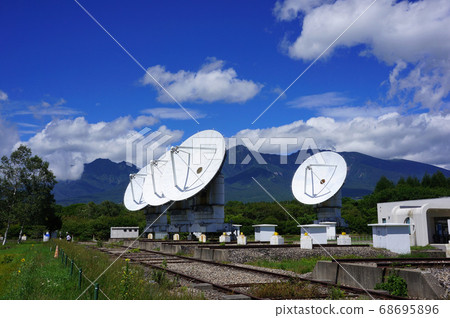Scenery with parabolic antenna at Nobeyama Space Radio Observatory and Yatsugatake 68695896