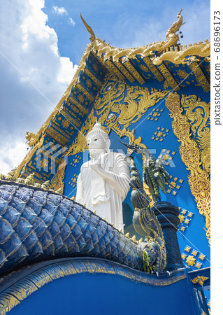 Standing White Buddha on Yellow Blue Wat Rong Suea Ten Church Background in Right View 68696173