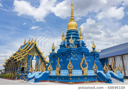 Blue Yellow Pagoda and Church of Wat Rong Suea Ten at Chiangrai Thailand 68696189