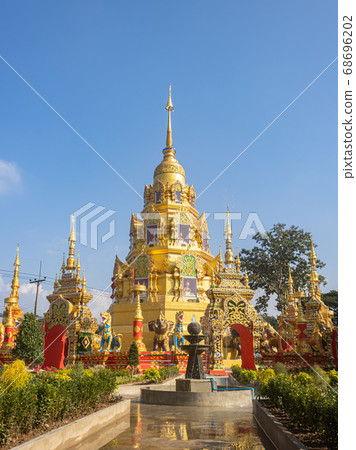 Gold Pagoda or Stupa on Blue Sky in Wat Phra Nang Din Gold Pagoda or Stupa on Blue Sky in Wat Phra Nang Din 68696202