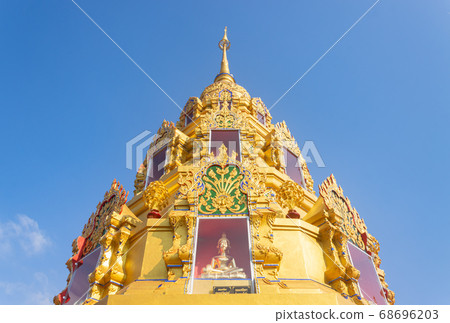 Gold Pagoda or Stupa on Blue Sky Background in Phra Nang Din Temple 68696203