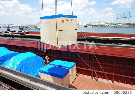 Wooden crates on a barge/shipping Wooden crates on a barge/shipping 68696286