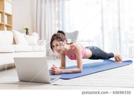 woman doing exercise at home 68696330