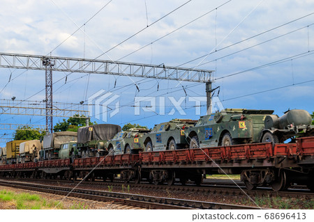 Cargo train carrying military vehicles 68696413