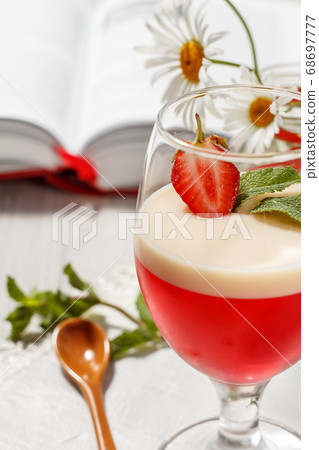Cherry and milk jelly with strawberry piece in 68697777