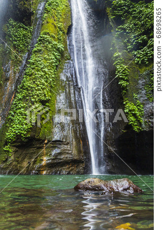Sekumpul Waterfalls surrounded by tropical forest Sekumpul Waterfalls surrounded by tropical forest 68698265