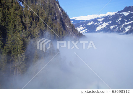 The river of white fog in mountains.Alpine Alps 68698512