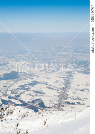 Untersberg Summit. The view from the summit of Untersberg mountain in Austria. The mountain straddles the border between Germany and Austria and in the background can be seen the city of Salzburg. 68699764