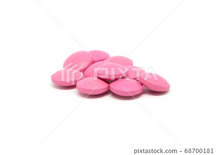 Pink pills isolated on white background 68700181