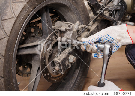 The process of replacing brake pads on a 68700771