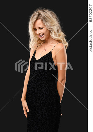 Charming young woman with curly hair Charming young woman with curly hair 68702207