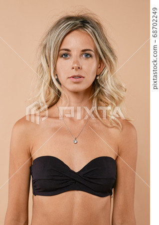 Close up portrait of young woman standing straight Close up portrait of young woman standing straight 68702249