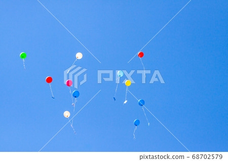 Colorful ballons with letters flying in the blue sky 68702579