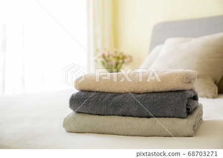 Freshly laundered bath in the bed at hotel room 68703271