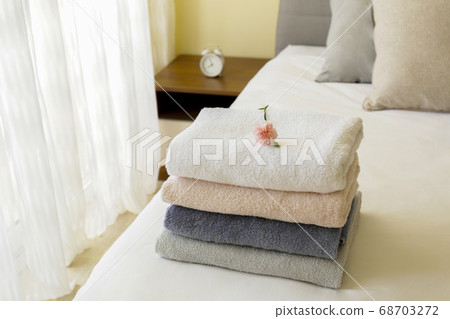 Freshly laundered bath in the bed at hotel room 68703272