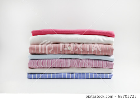 Clean garment neatly folded after laundry over Clean garment neatly folded after laundry over 68703725