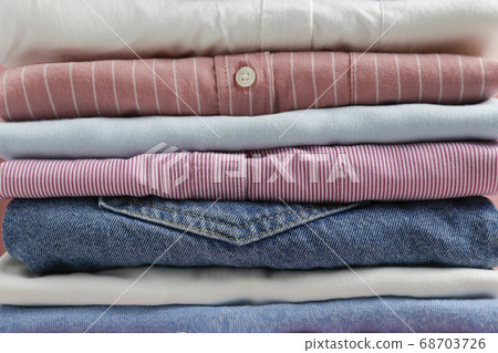 Clean garment neatly folded after laundry over Clean garment neatly folded after laundry over 68703726