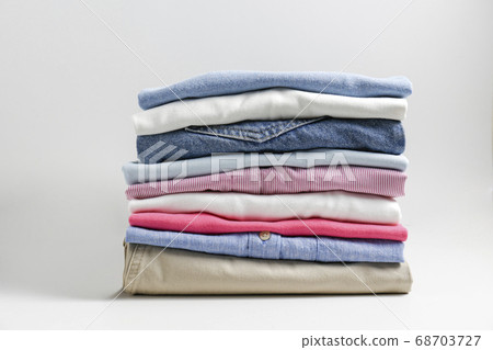 Clean garment neatly folded after laundry over Clean garment neatly folded after laundry over 68703727