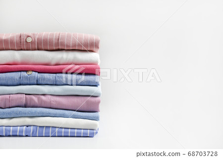 Clean garment neatly folded after laundry over Clean garment neatly folded after laundry over 68703728