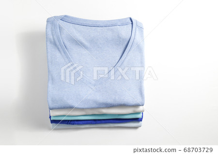 Clean garment neatly folded after laundry over Clean garment neatly folded after laundry over 68703729