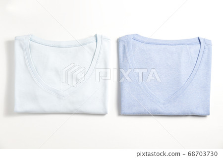 Clean garment neatly folded after laundry over Clean garment neatly folded after laundry over 68703730